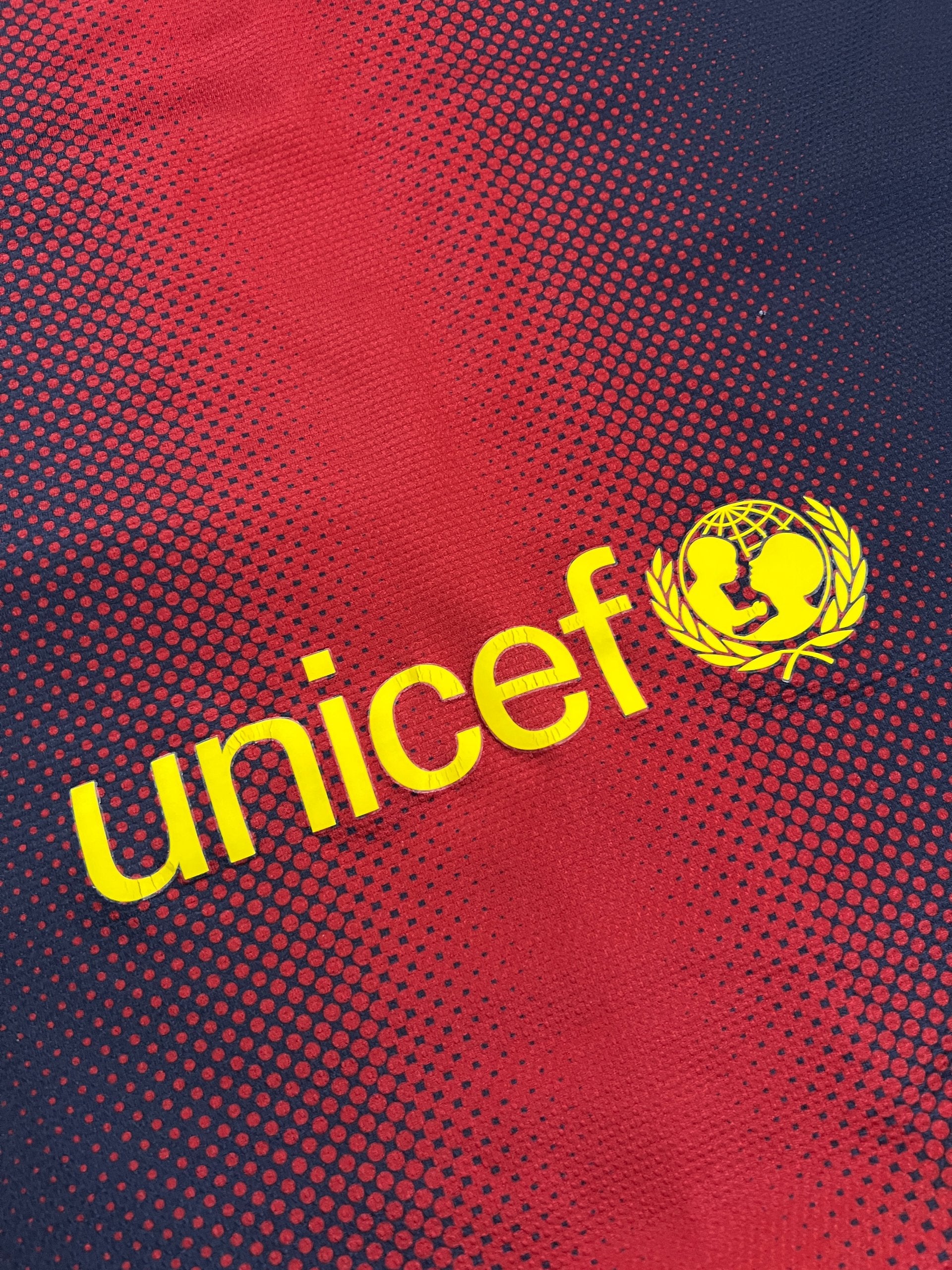 Nike FC Barcelona navy and red football shirt with Qatar Foundation logo and La Liga patches.