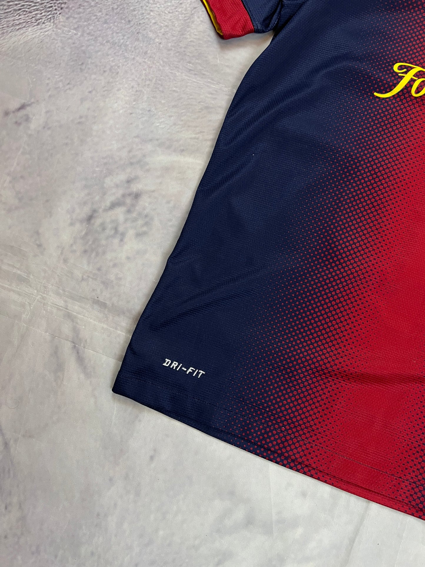 Nike FC Barcelona navy and red football shirt with Qatar Foundation logo and La Liga patches.