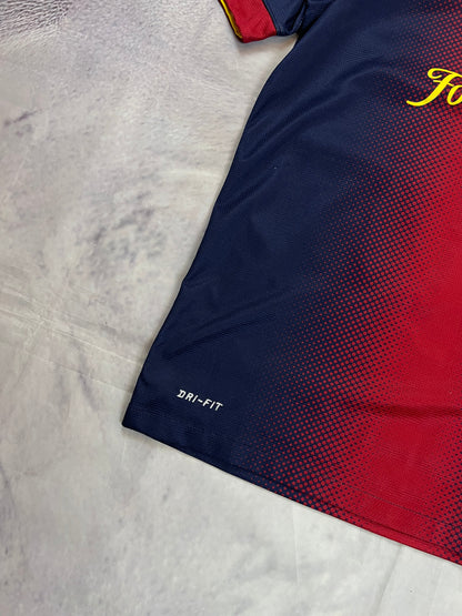 Nike FC Barcelona navy and red football shirt with Qatar Foundation logo and La Liga patches.