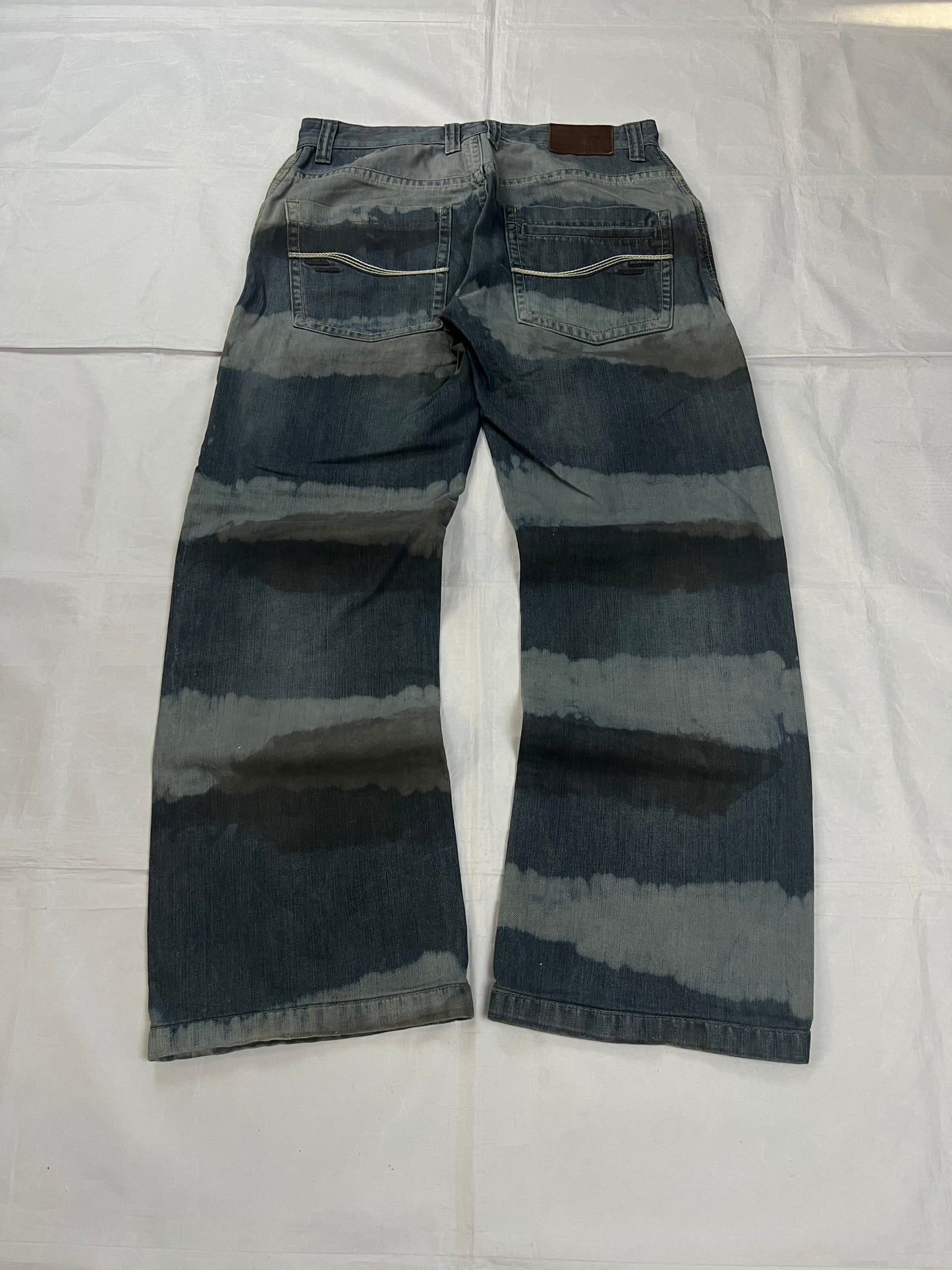 Lee blue and grey striped denim jeans with loose fit and decorative stitching.