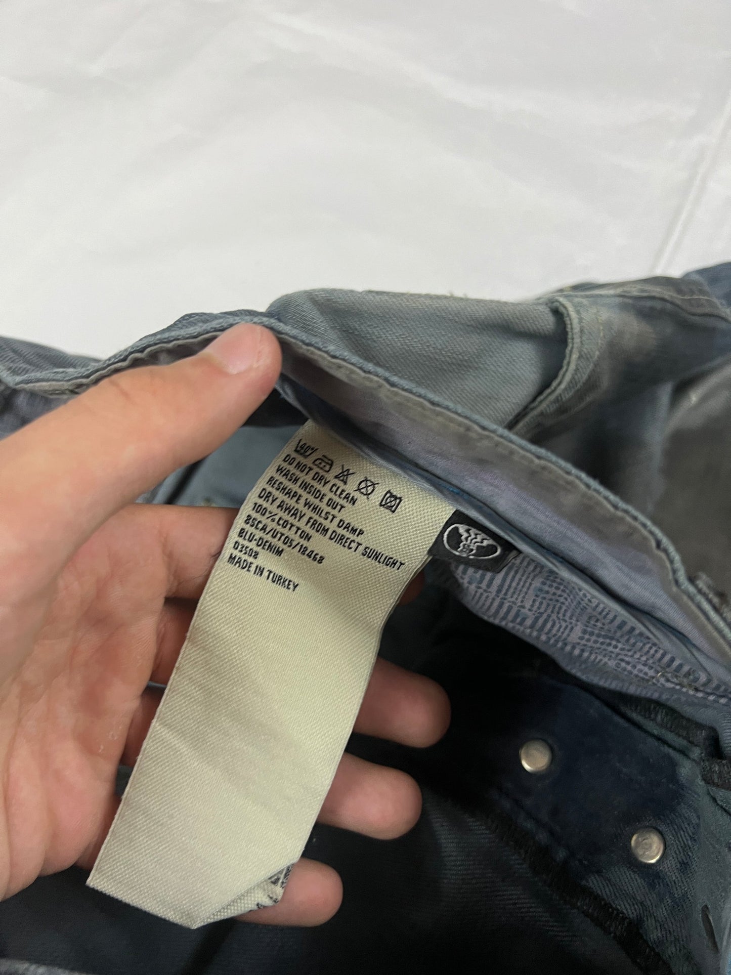 Lee blue and grey striped denim jeans with loose fit and decorative stitching.