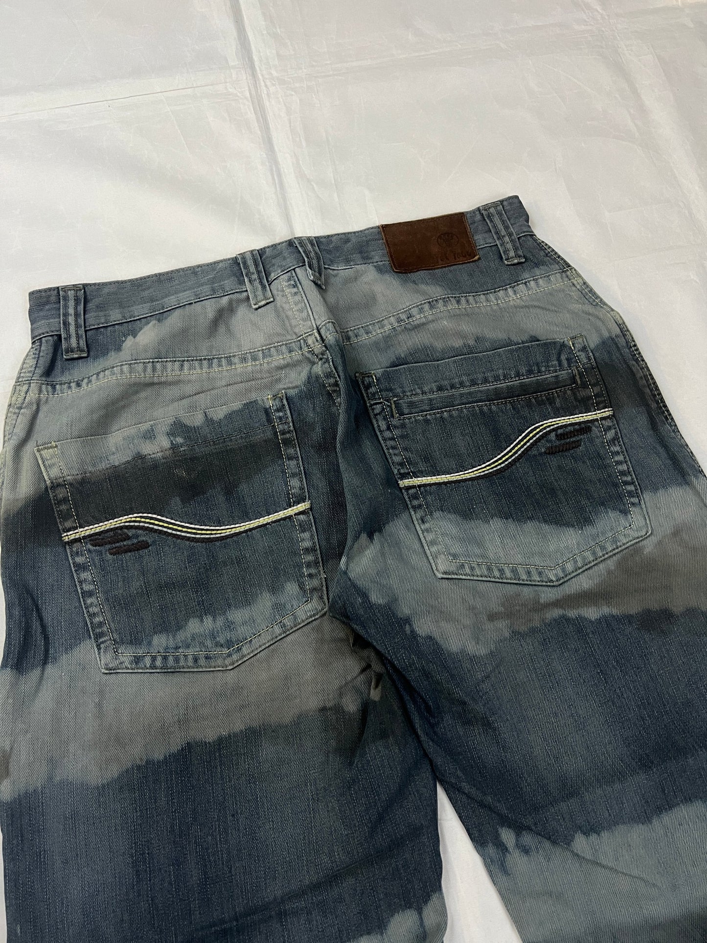 Lee blue and grey striped denim jeans with loose fit and decorative stitching.