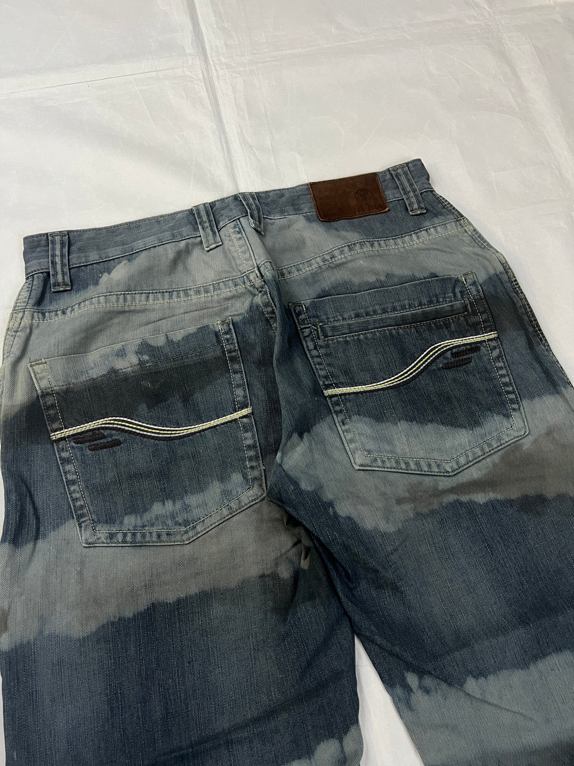 Lee blue and grey striped denim jeans with loose fit and decorative stitching.