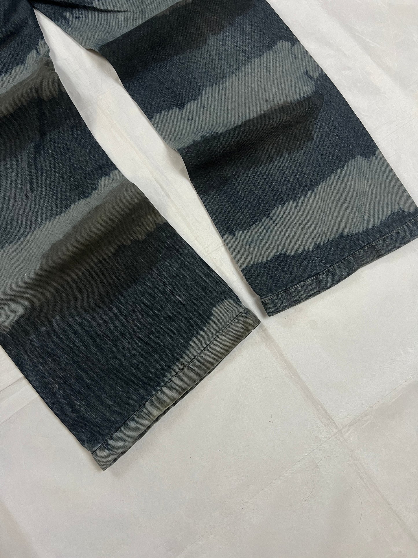 Lee blue and grey striped denim jeans with loose fit and decorative stitching.