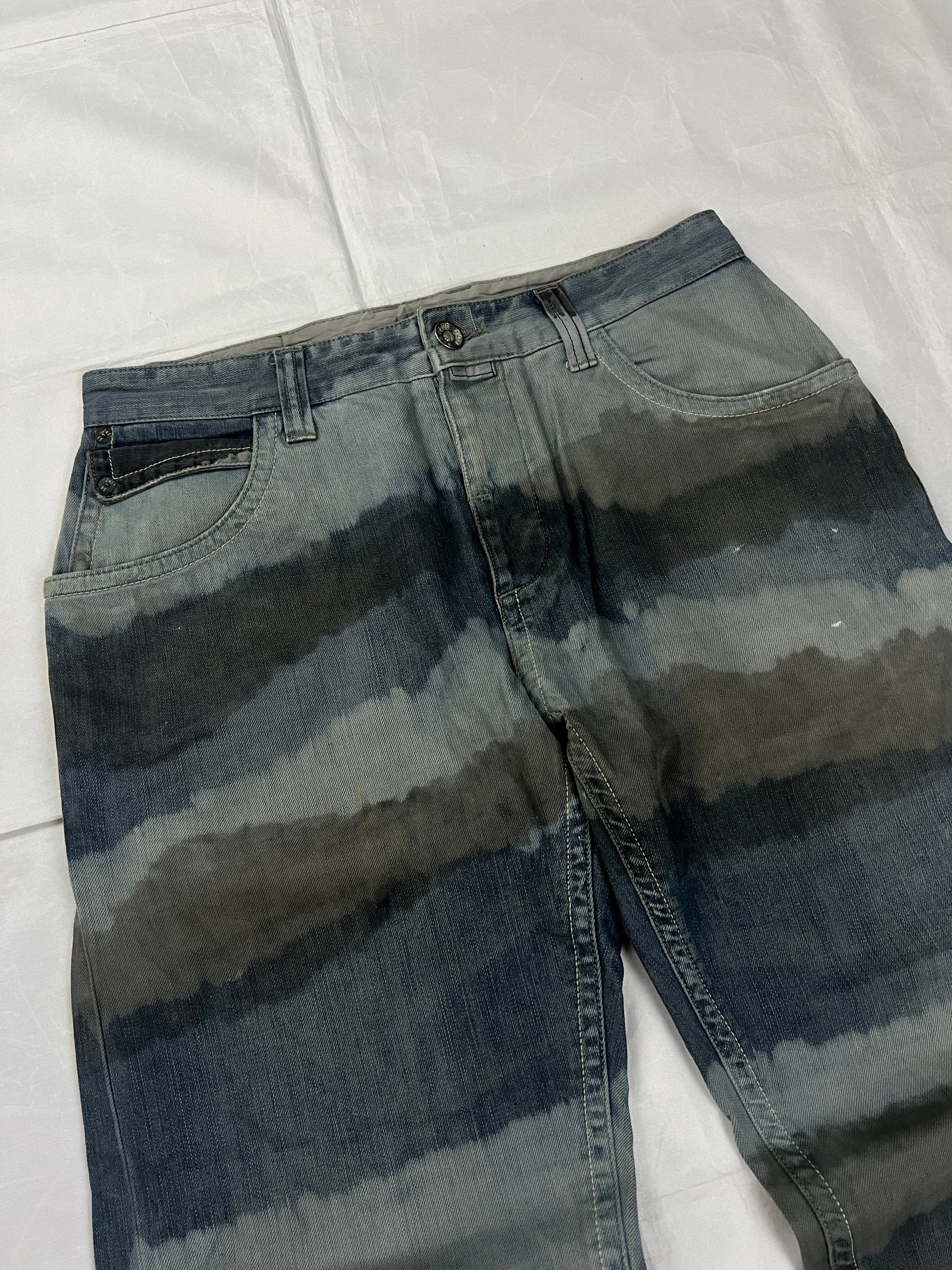 Lee blue and grey striped denim jeans with loose fit and decorative stitching.