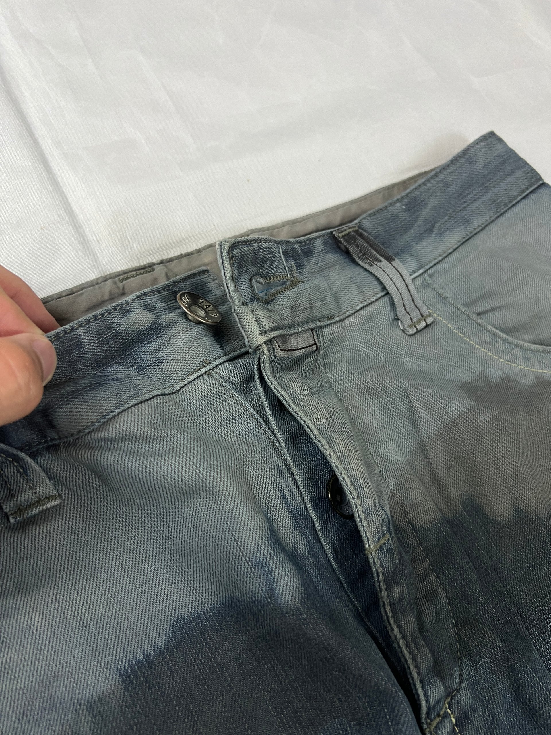 Lee blue and grey striped denim jeans with loose fit and decorative stitching.