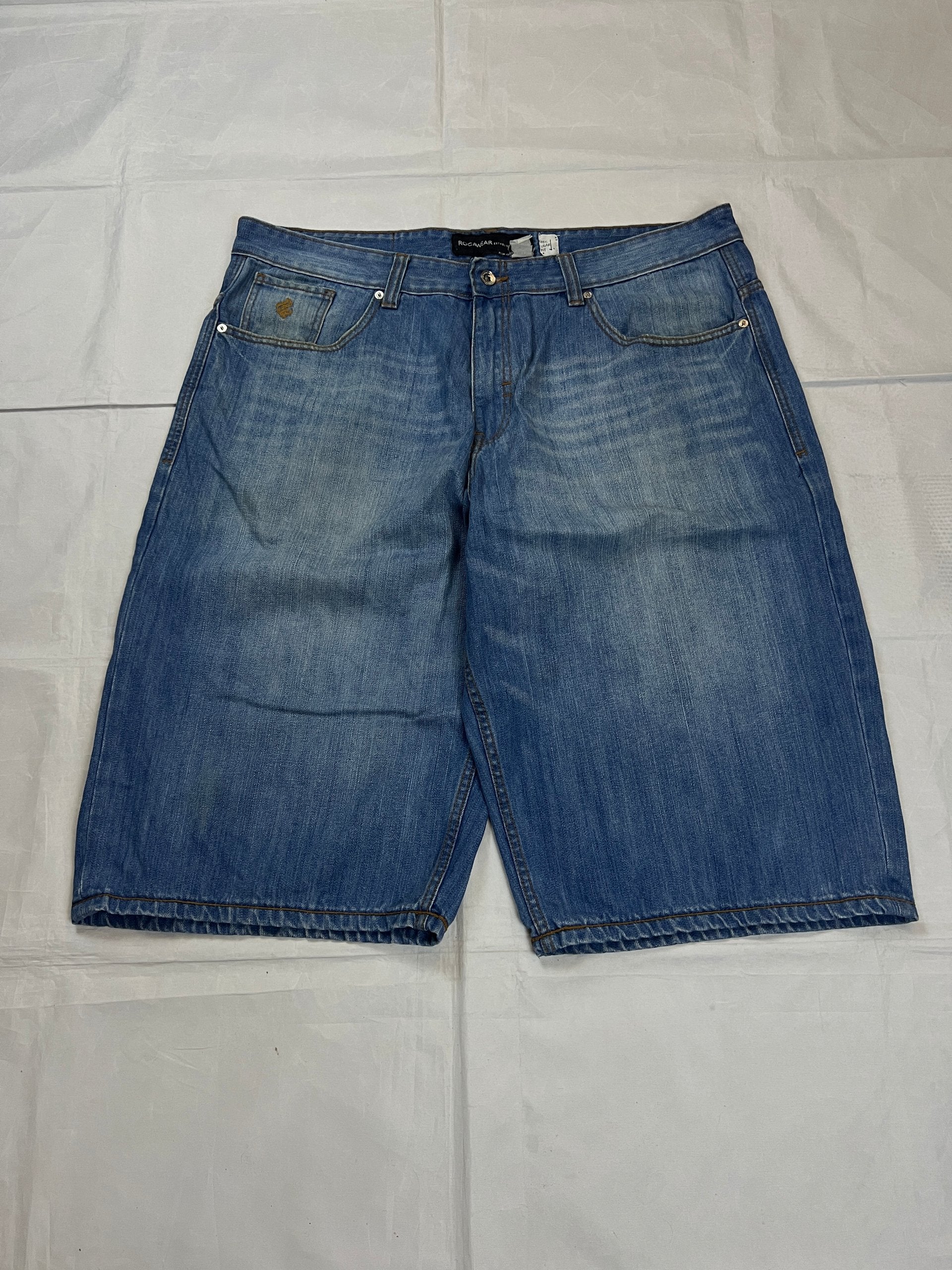 Rocawear blue denim shorts W38 five-pocket design with embroidered back pockets and branded label.