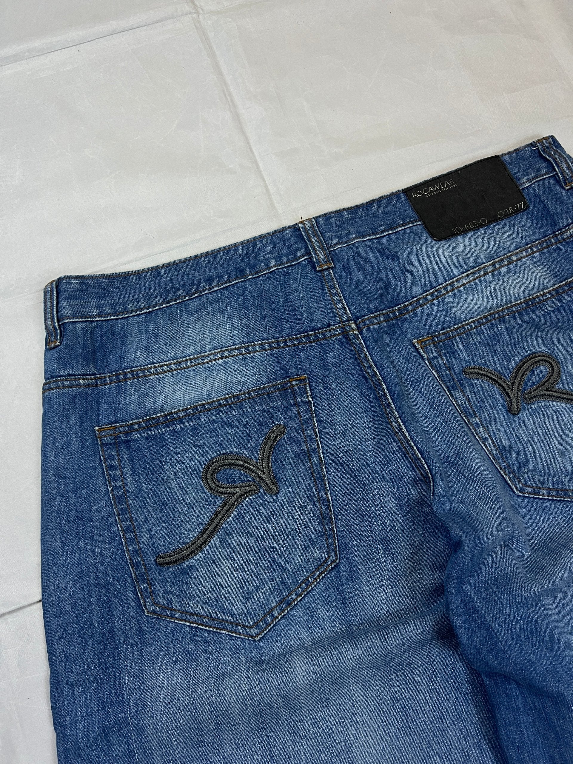 Rocawear blue denim shorts W38 five-pocket design with embroidered back pockets and branded label.