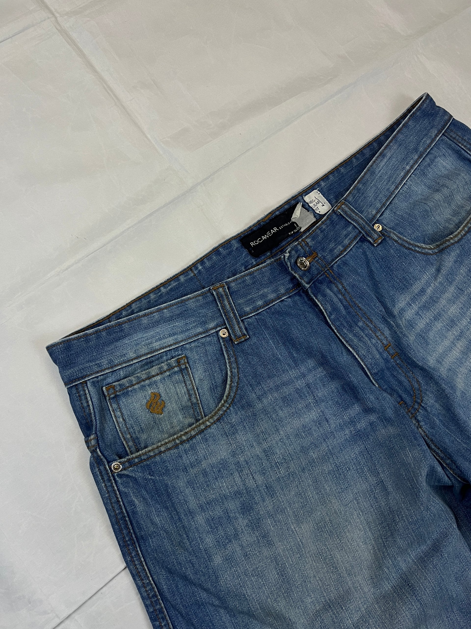 Rocawear blue denim shorts W38 five-pocket design with embroidered back pockets and branded label.