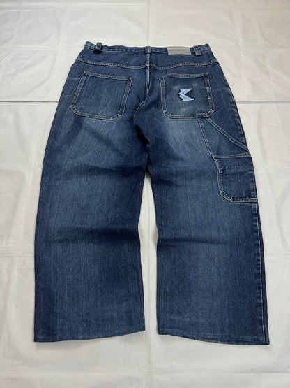 Kani blue denim carpenter jeans with distressed details, faded wash, and patch pockets.