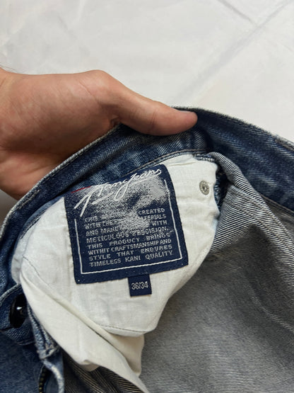 Kani blue denim carpenter jeans with distressed details, faded wash, and patch pockets.
