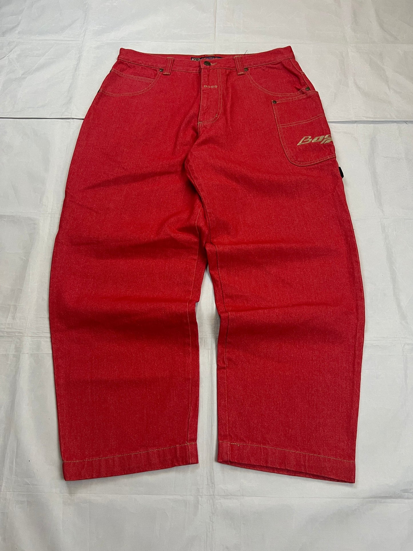 BOSS red carpenter jeans 100% cotton with yellow stitching and logo detailing.