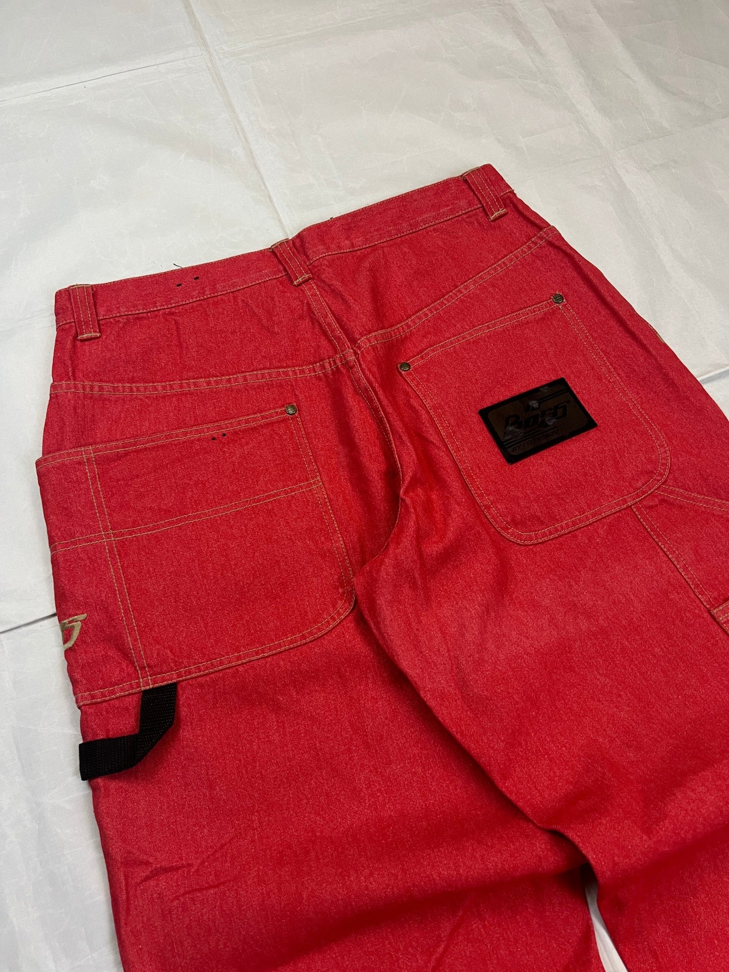 BOSS red carpenter jeans 100% cotton with yellow stitching and logo detailing.