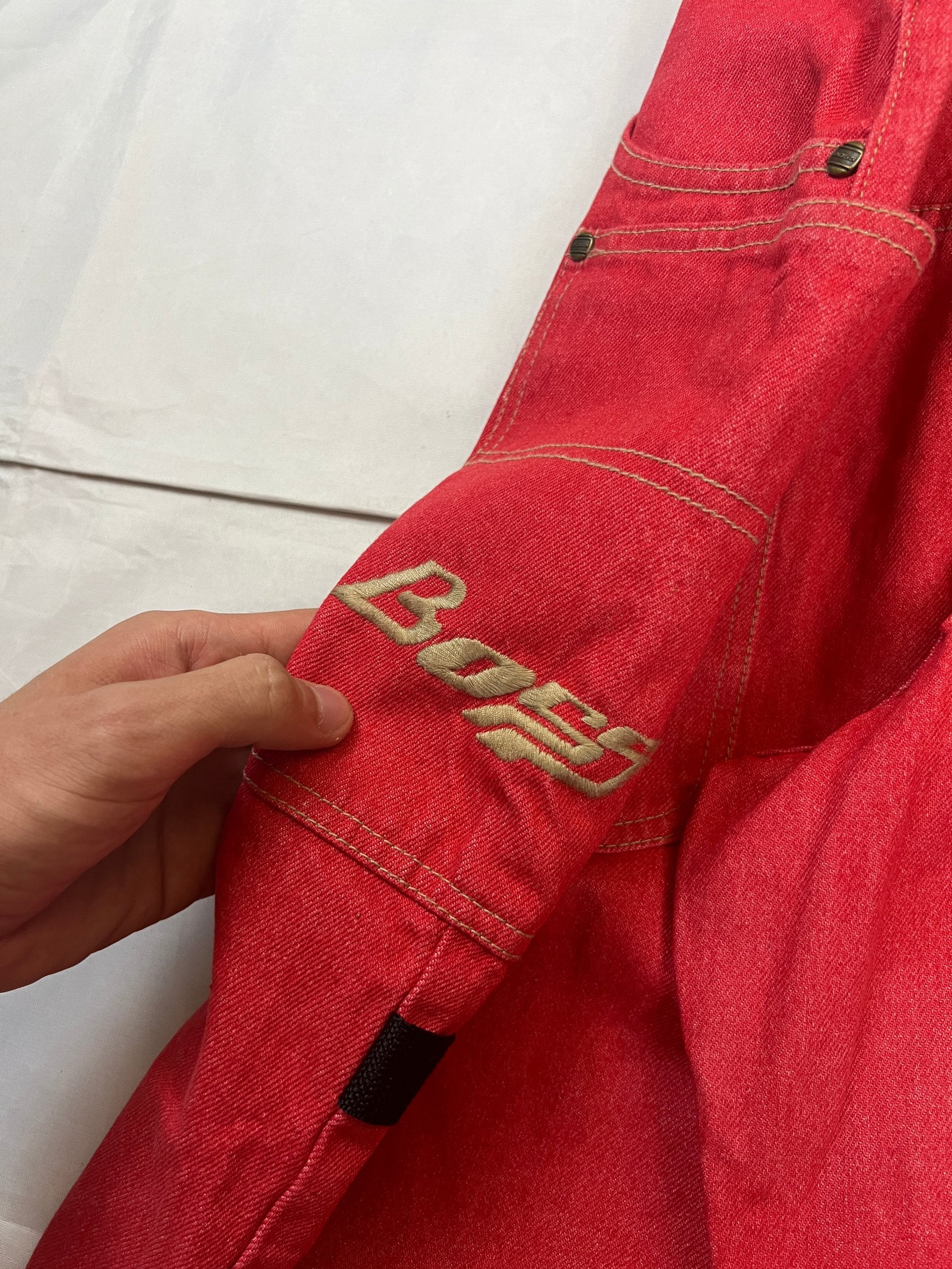 BOSS red carpenter jeans 100% cotton with yellow stitching and logo detailing.