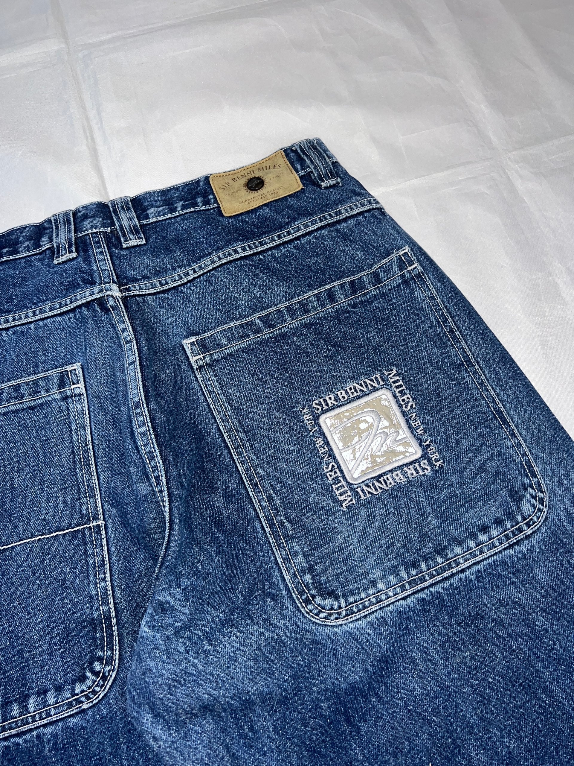 SIR BENNI MILES blue wide-leg jeans distressed with rips, branded back pockets, 100% cotton.