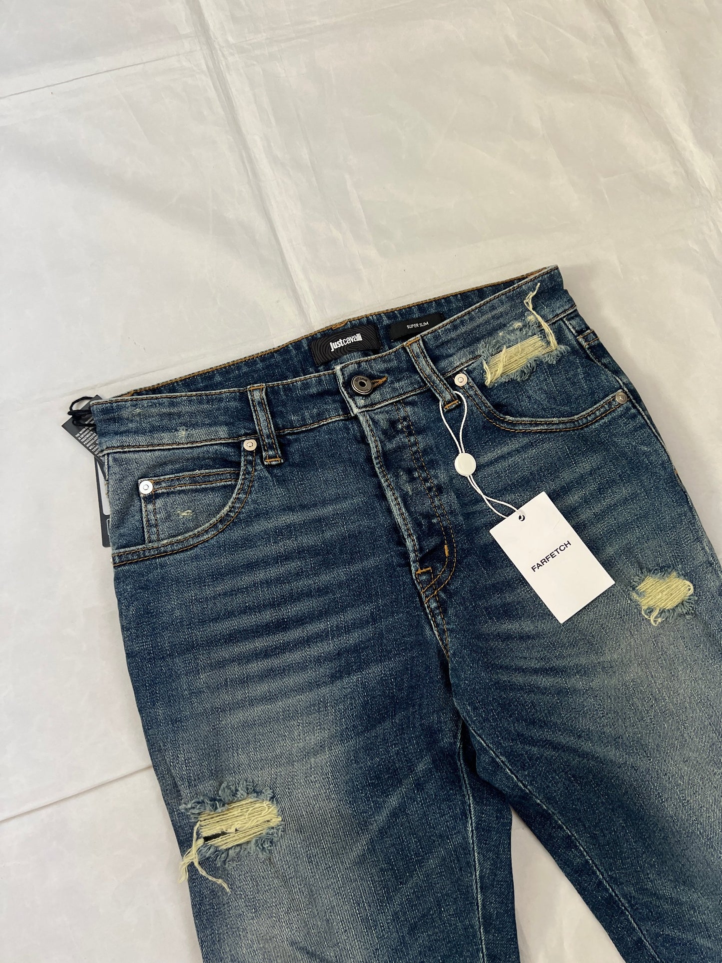 Just Cavalli blue distressed denim jeans UK 10 with black eagle prints on knees.