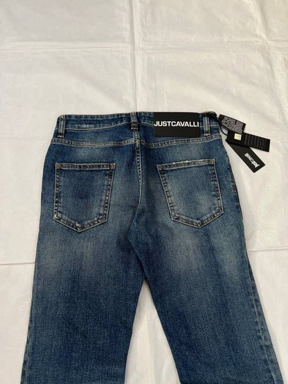 Just Cavalli blue distressed denim jeans UK 10 with black eagle prints on knees.
