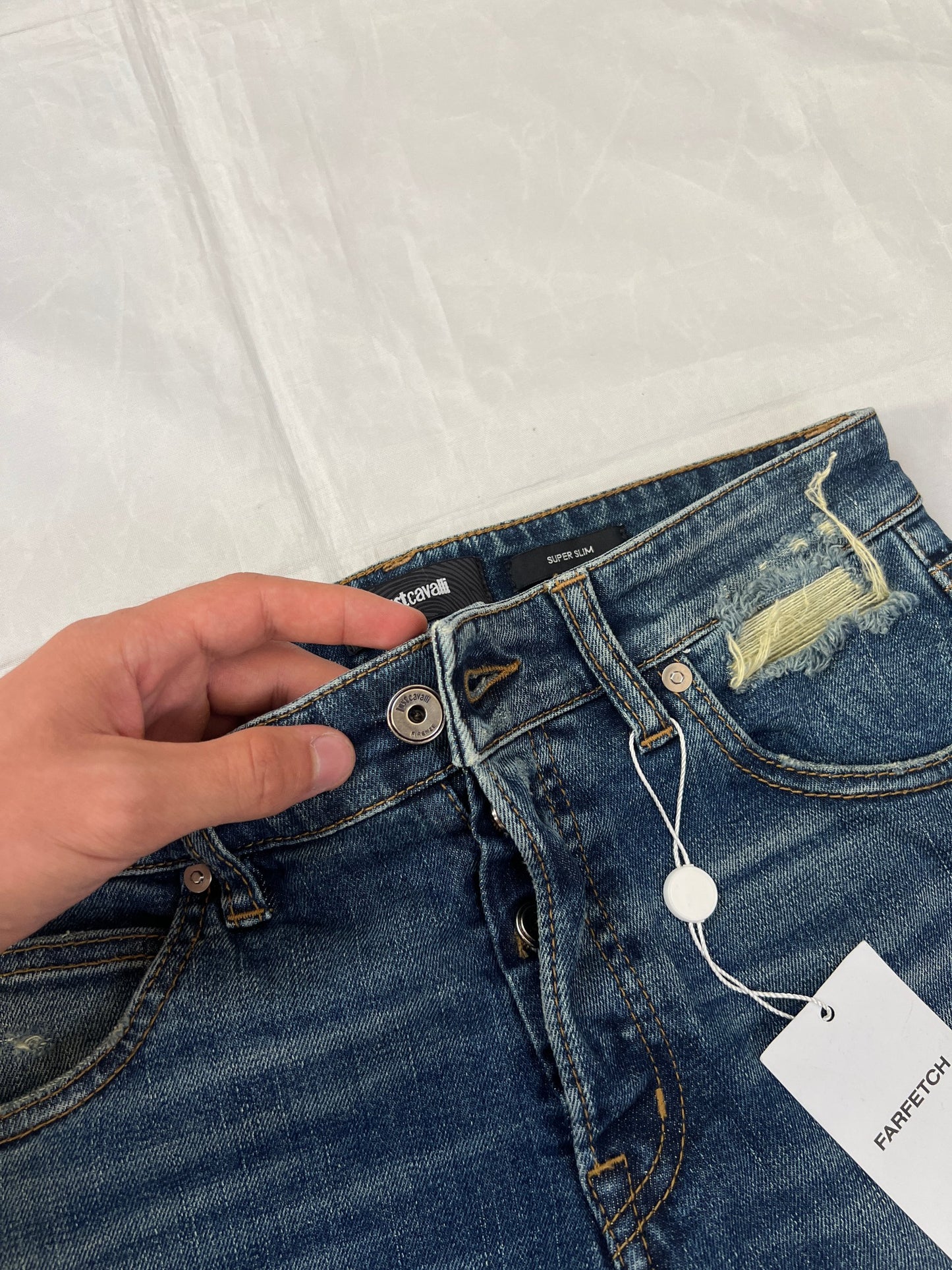 Just Cavalli blue distressed denim jeans UK 10 with black eagle prints on knees.