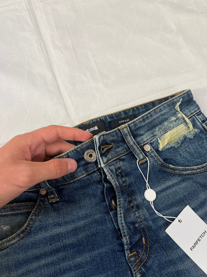 Just Cavalli blue distressed denim jeans UK 10 with black eagle prints on knees.