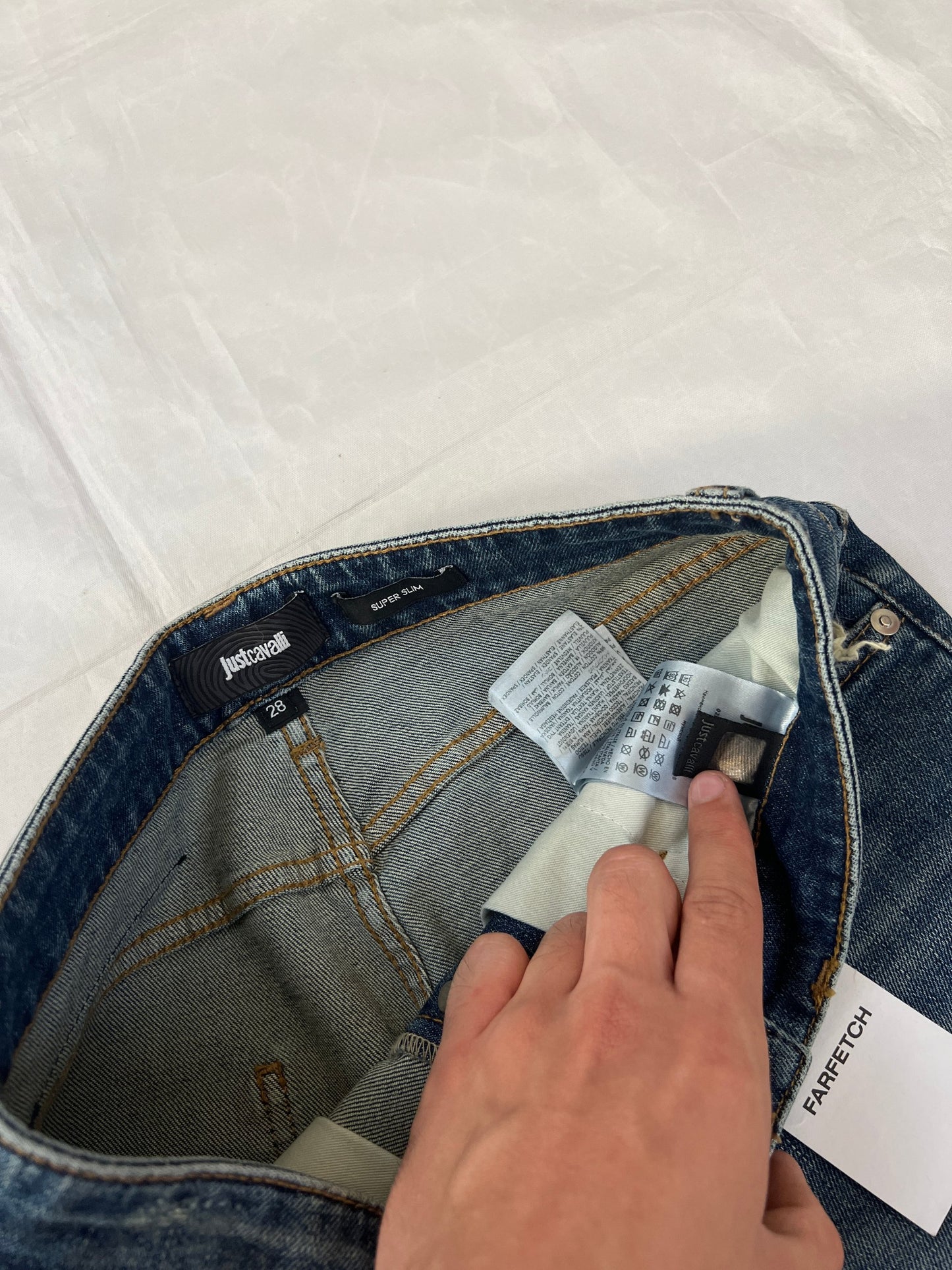 Just Cavalli blue distressed denim jeans UK 10 with black eagle prints on knees.
