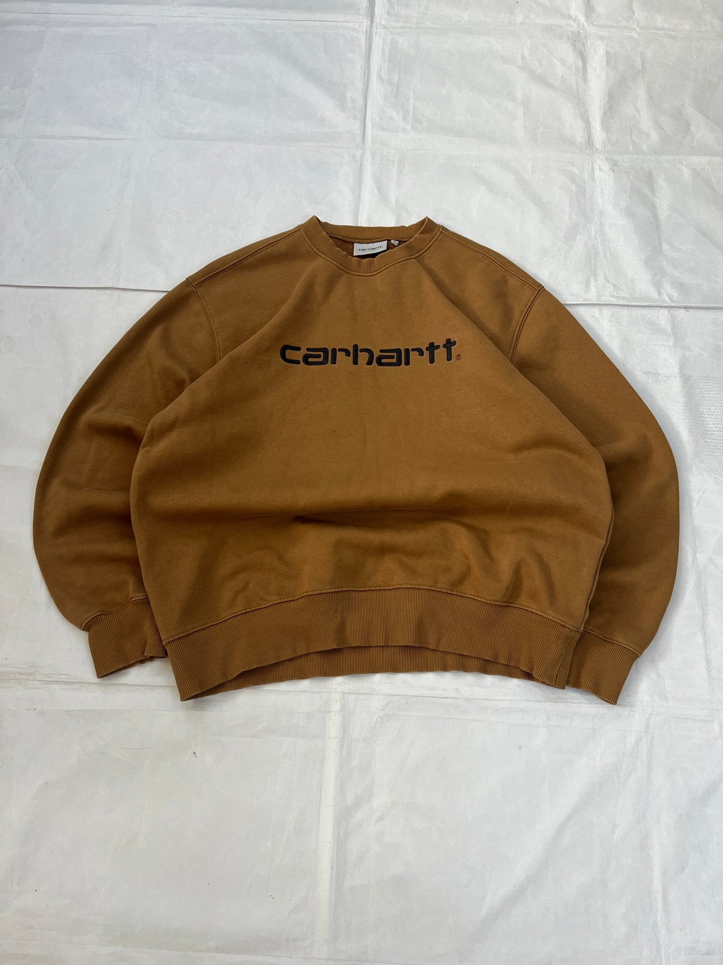 Carhartt brown hooded sweatshirt with black logo, fleece lined cotton-poly blend.