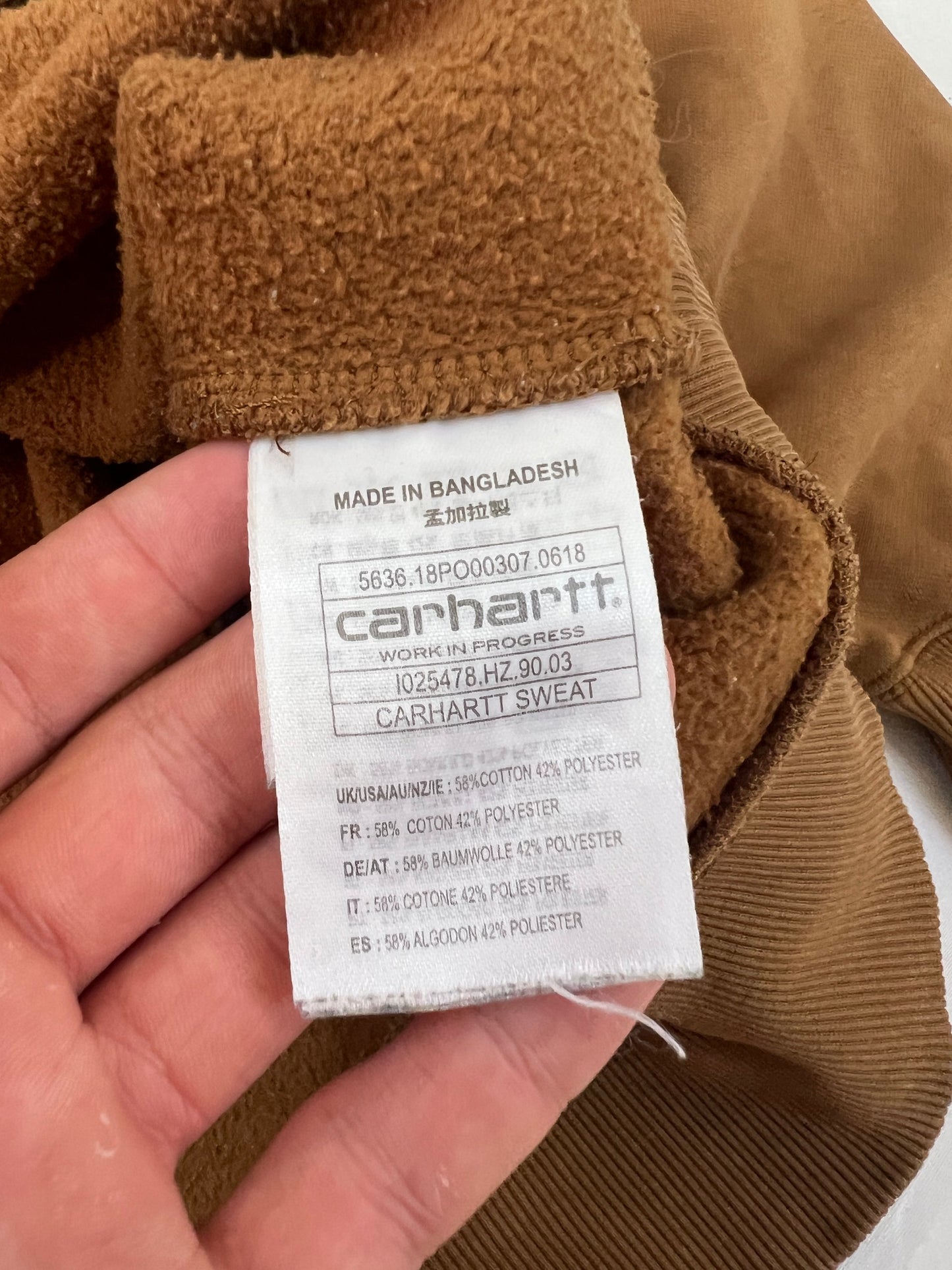 Carhartt brown hooded sweatshirt with black logo, fleece lined cotton-poly blend.