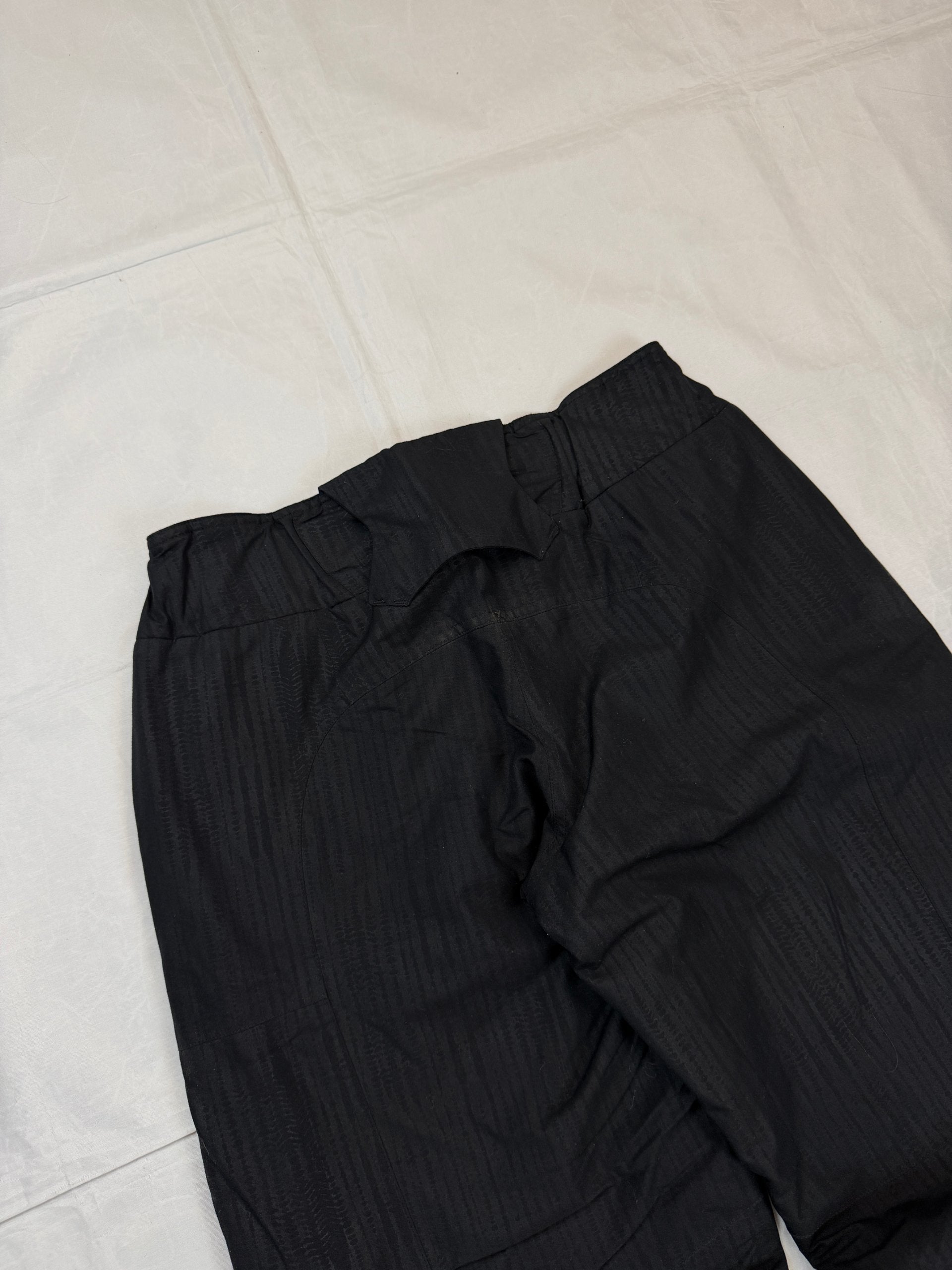 Nike black snow pants with ACG and Gore-Tex logos, adjustable waist, zippered vents.