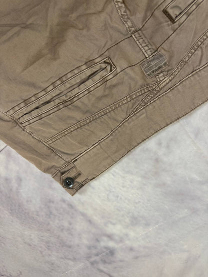 G-Star Raw beige cotton trousers with flap pockets and branded metal button closure.