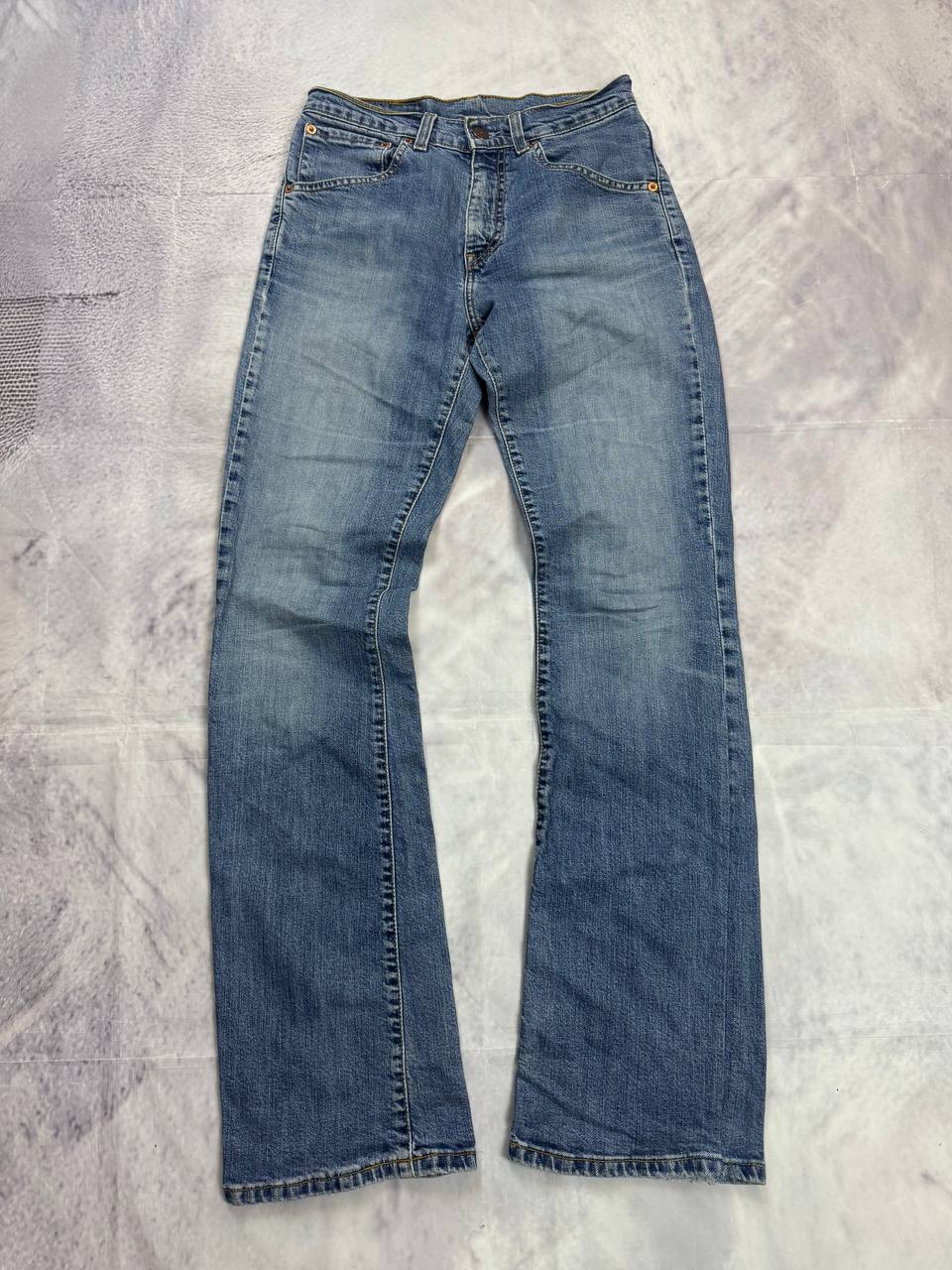 Levi's blue denim jeans with classic five-pocket design and iconic patch on waistband.