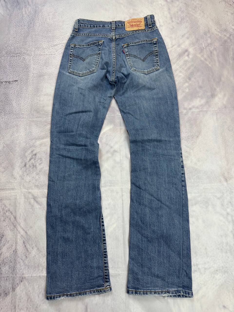 Levi's blue denim jeans with classic five-pocket design and iconic patch on waistband.