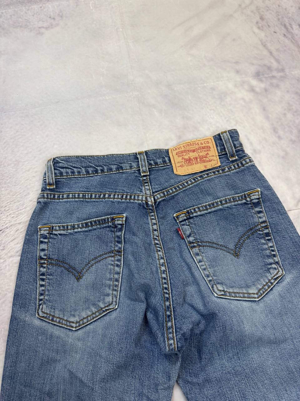 Levi's blue denim jeans with classic five-pocket design and iconic patch on waistband.