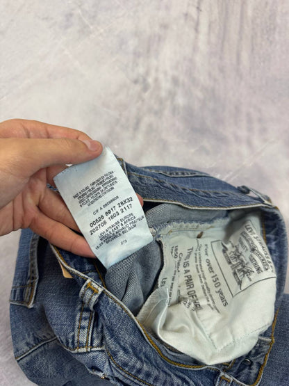 Levi's blue denim jeans with classic five-pocket design and iconic patch on waistband.