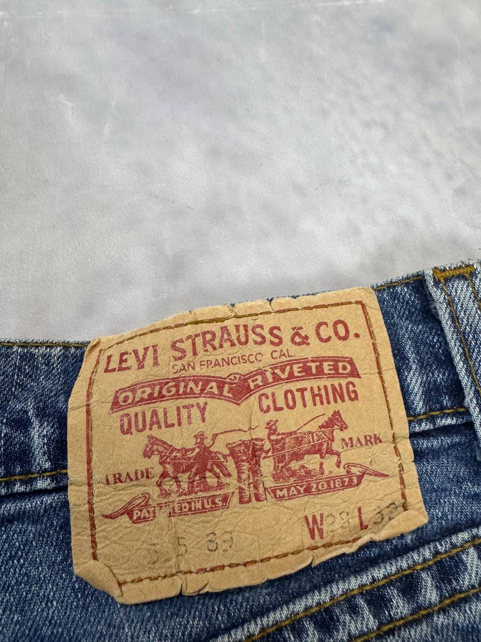 Levi's blue denim jeans with classic five-pocket design and iconic patch on waistband.