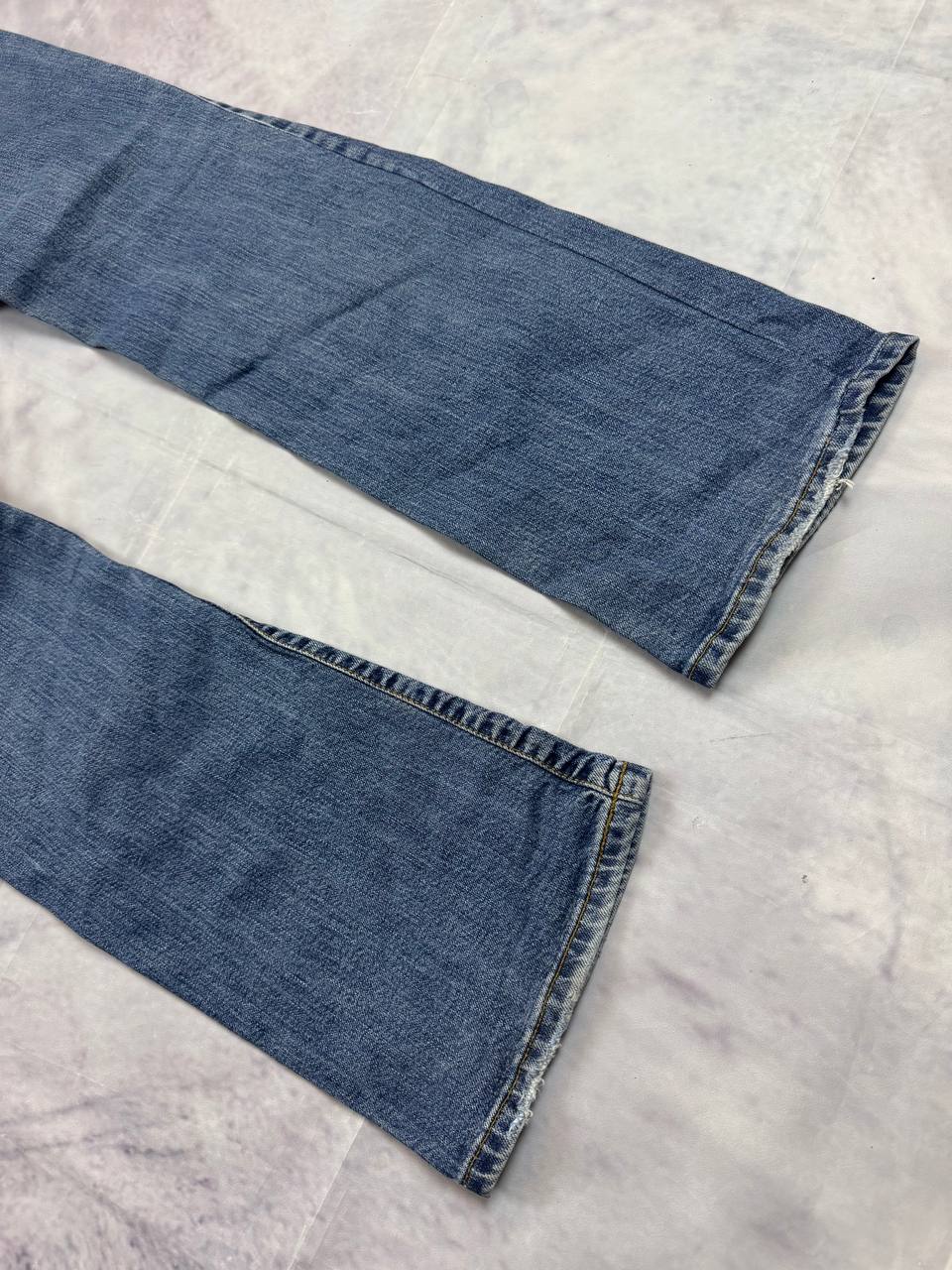 Levi's blue denim jeans with classic five-pocket design and iconic patch on waistband.