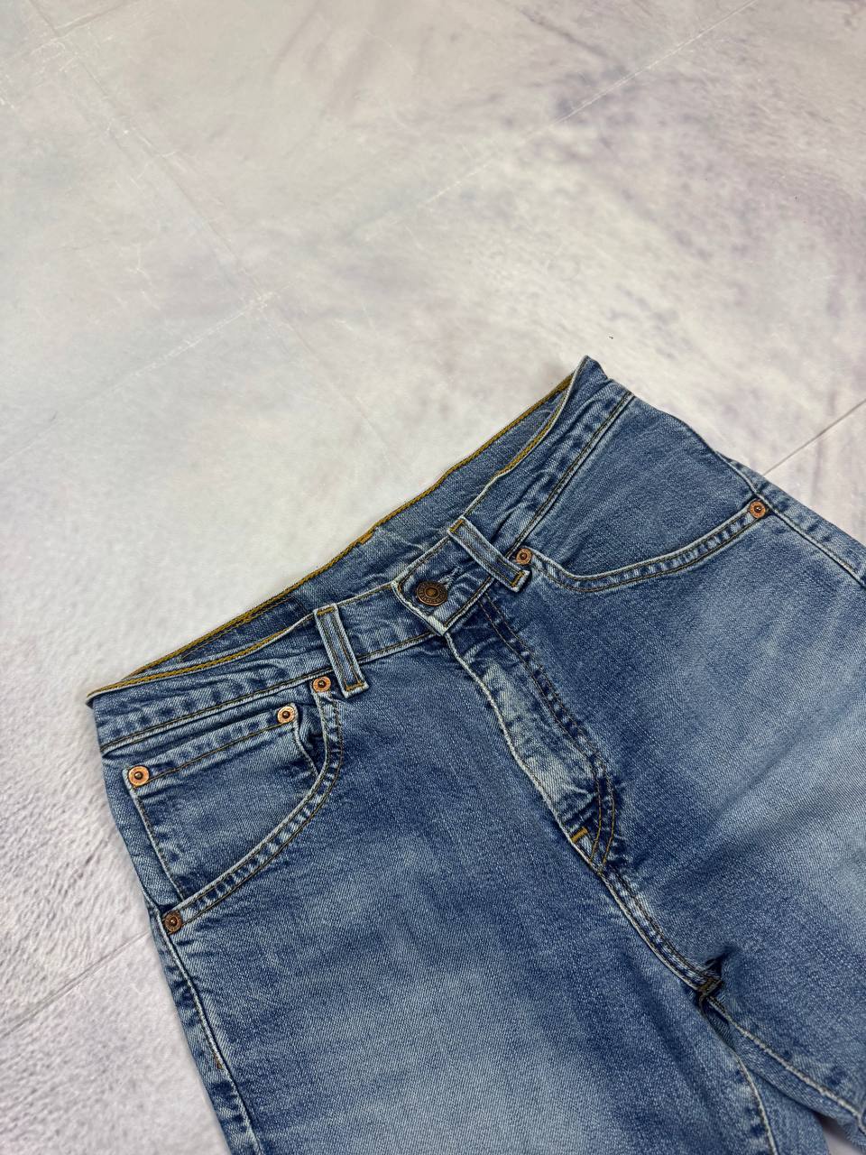 Levi's blue denim jeans with classic five-pocket design and iconic patch on waistband.