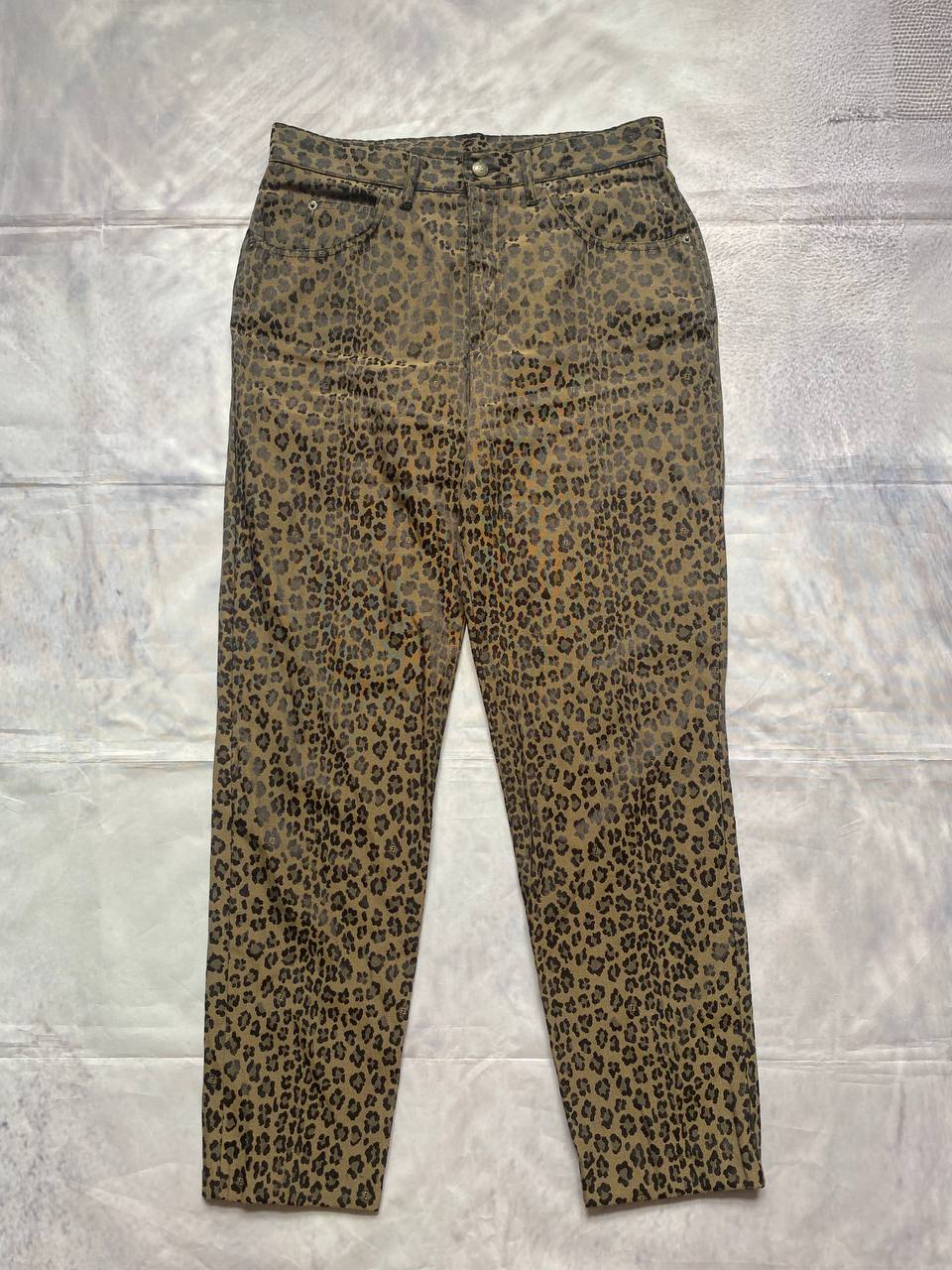 Iceberg brown leopard print trousers with front pockets and metal button closure.