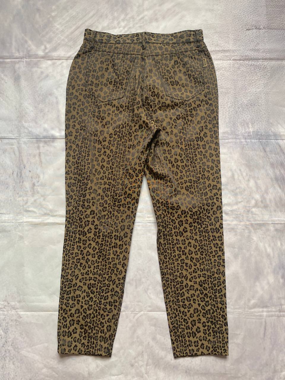 Iceberg brown leopard print trousers with front pockets and metal button closure.