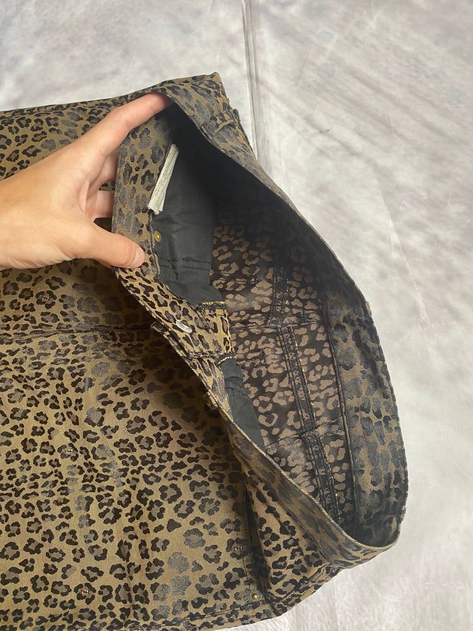 Iceberg brown leopard print trousers with front pockets and metal button closure.