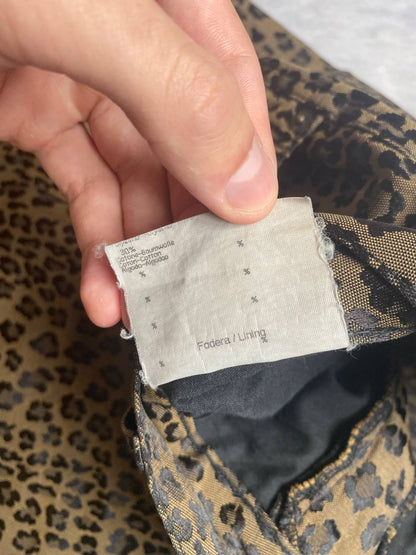 Iceberg brown leopard print trousers with front pockets and metal button closure.