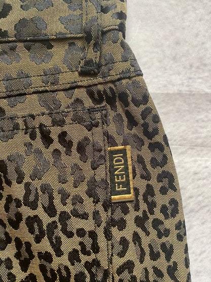 Iceberg brown leopard print trousers with front pockets and metal button closure.