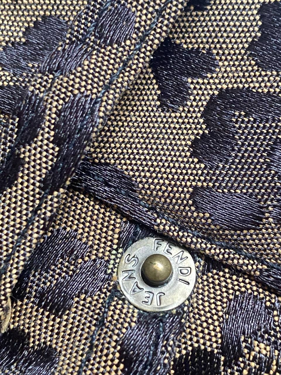 Iceberg brown leopard print trousers with front pockets and metal button closure.