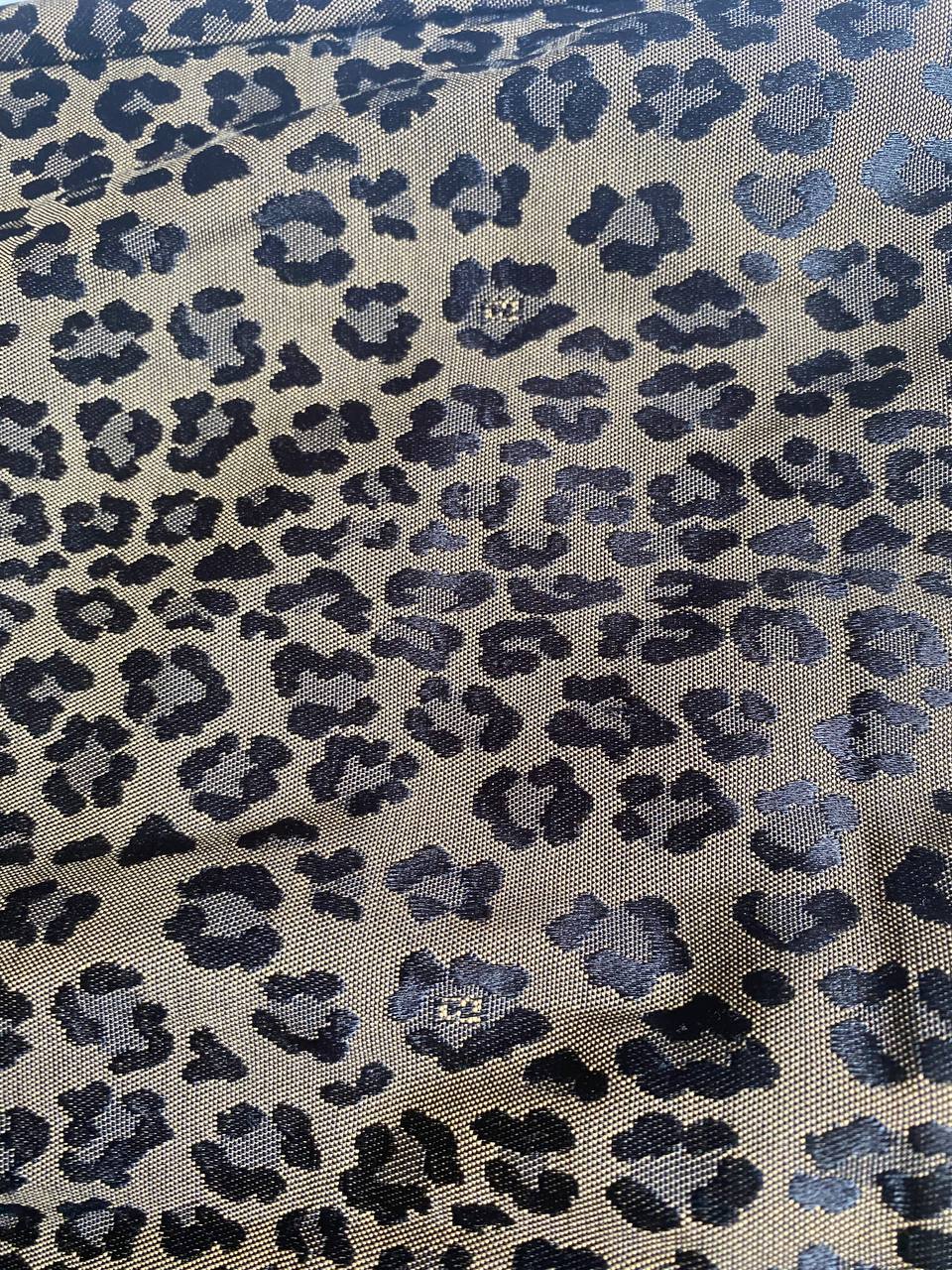 Iceberg brown leopard print trousers with front pockets and metal button closure.