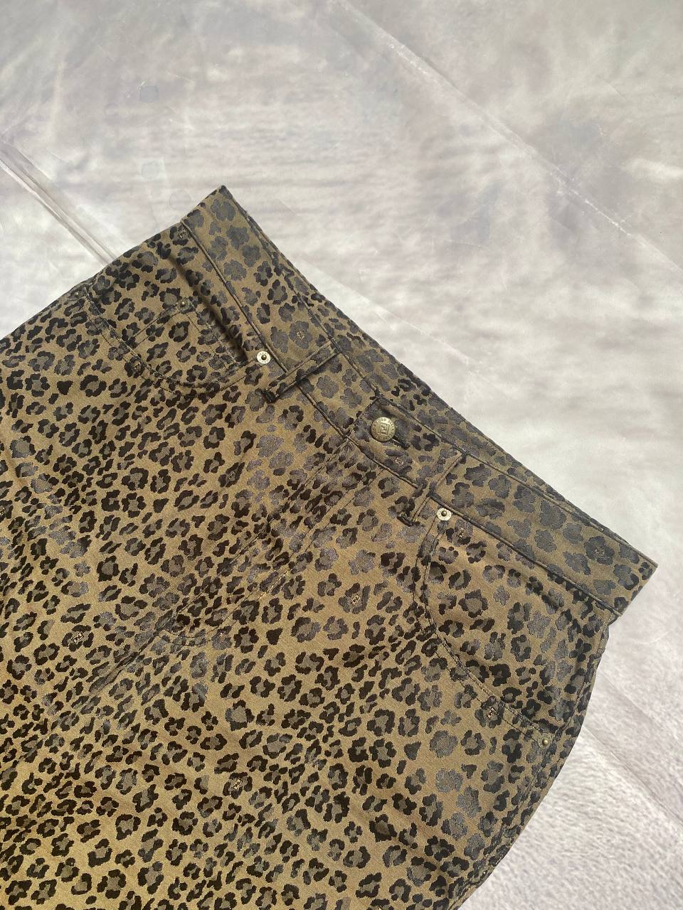 Iceberg brown leopard print trousers with front pockets and metal button closure.