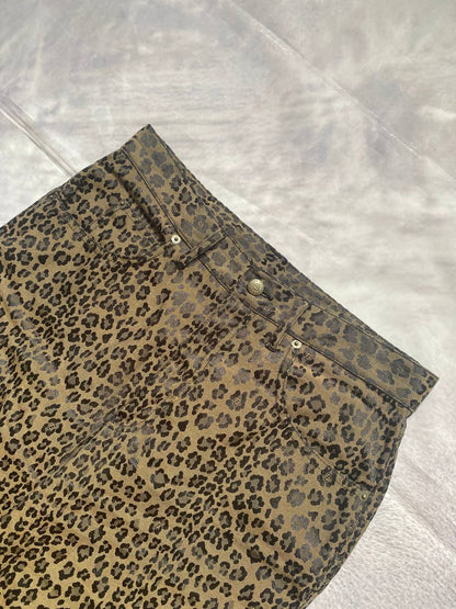 Iceberg brown leopard print trousers with front pockets and metal button closure.