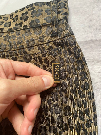 Iceberg brown leopard print trousers with front pockets and metal button closure.