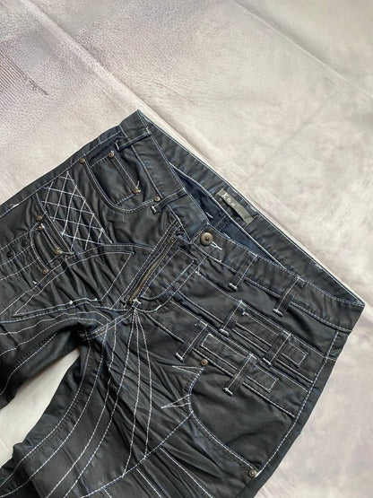 K&M black jeans size 38 with detailed white stitching and metallic stud accents.