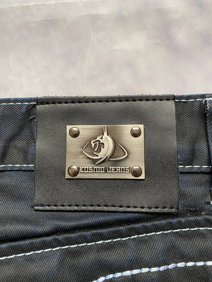 K&M black jeans size 38 with detailed white stitching and metallic stud accents.