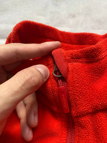 Marmot red fleece jacket with full zip, thumb holes, and elbow patch detail.