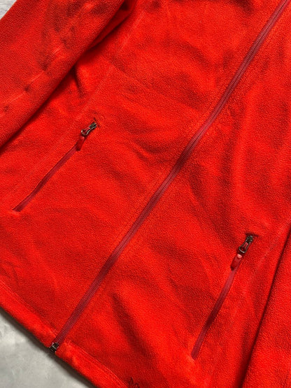 Marmot red fleece jacket with full zip, thumb holes, and elbow patch detail.