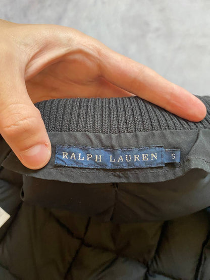 Ralph Lauren black puffer gilet vest with brown zippered pockets and ribbed neck.